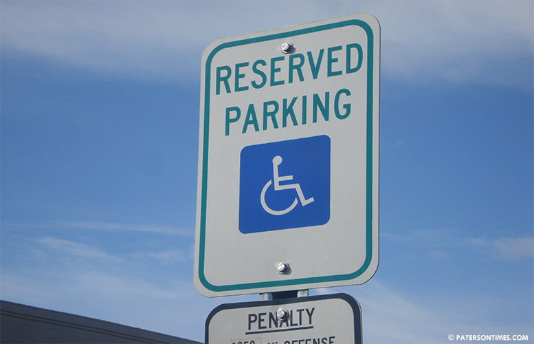 handicap-pole-with-reserved-parking-sign