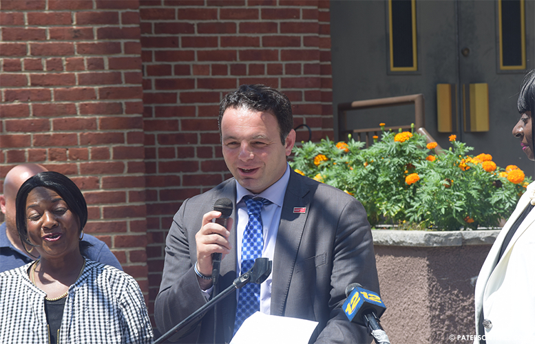 Sayegh announces his road repair plan in front of the St. Bonaventure's Church on Ramsey Street.