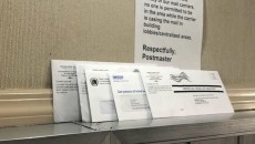 Mail-in ballots left on top of mailboxes at Kent Village.
