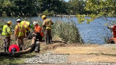 A crew installing a pipe that will deliver fresh water to the New Street Reservoir which was contaminated by runoff.